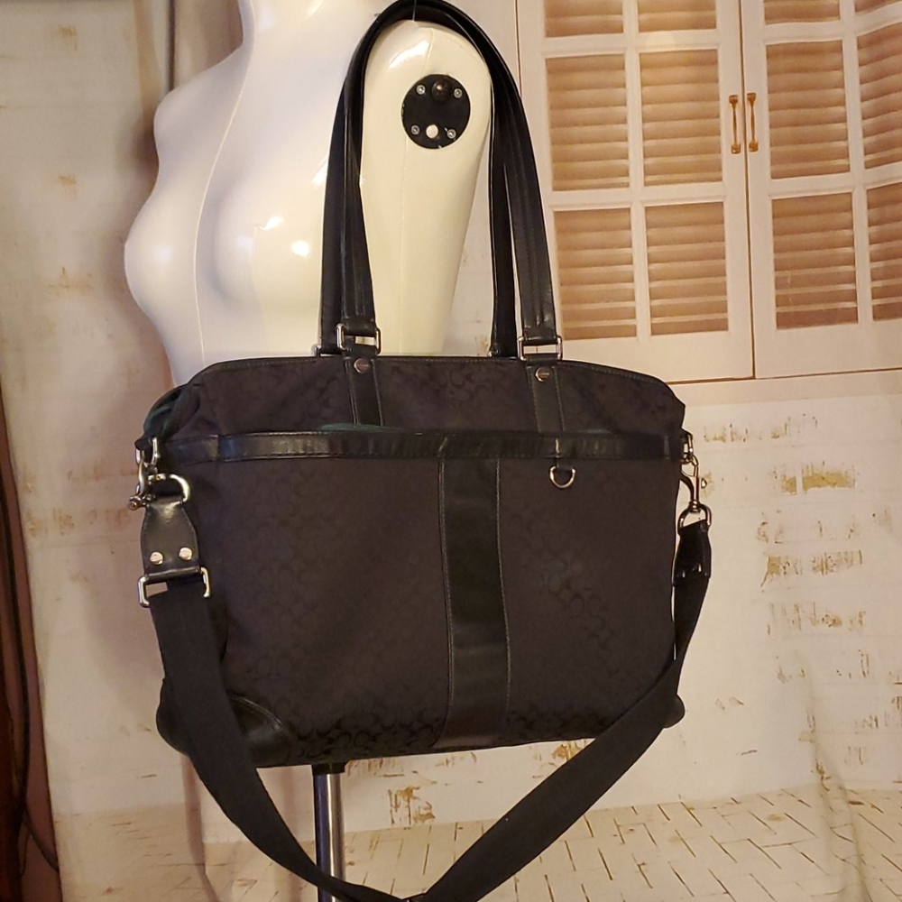 Coach diaper bag with changing pad.